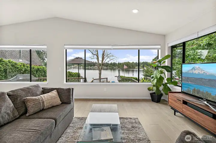 Cozy living room view with Lake Sawyer framed by oversized windows.