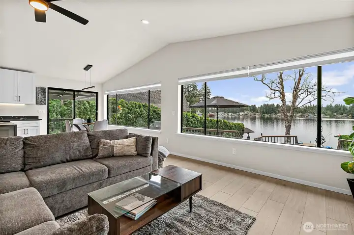 Living room with lake views, large windows, and a comfortable open layout.