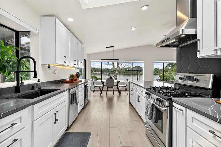 Kitchen view toward the dining area with Lake Sawyer visible through the large windows.