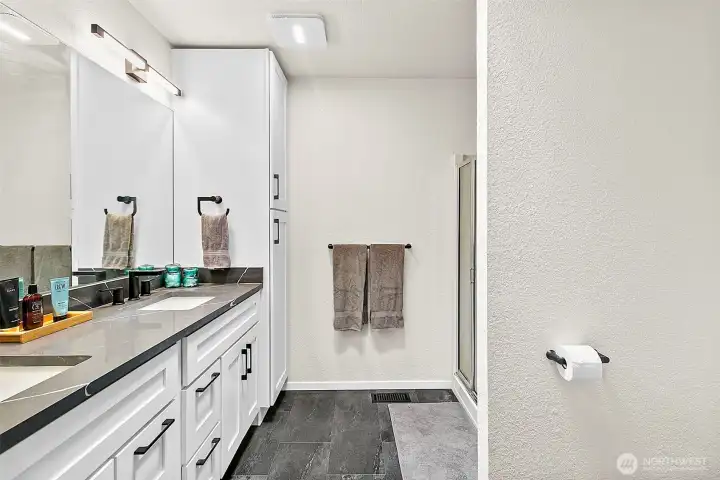 Bathroom vanity area with clean storage and simple modern finishes.