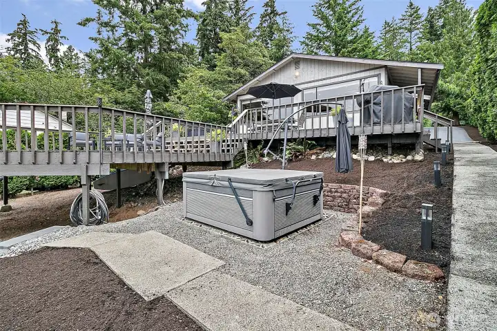 Saltwater hot tub area with easy deck access and low-maintenance outdoor space.