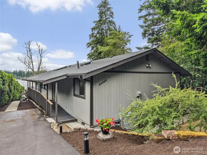 Exterior view of the updated Lake Sawyer rambler with side yard access.