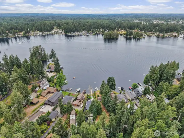 Drone view of the Lake Sawyer neighborhood and nearby waterfront homes.
