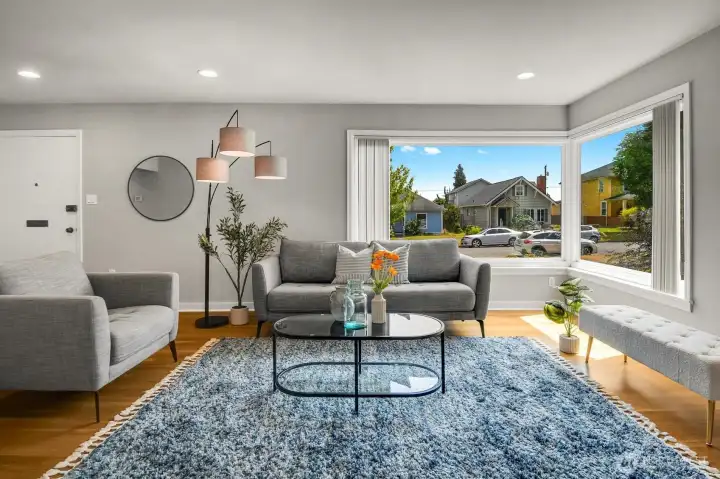 Living Room filled with natural light and beautiful hardwood floors. Living Room filled with natural light and beautiful hardwood floors.