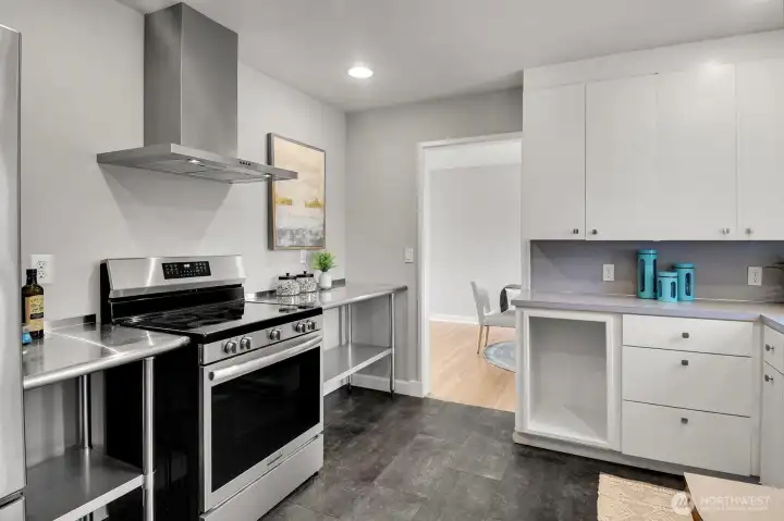 Current range is electric, but owners thoughtfully installed a gas line to kitchen in 2017 when they added a gas meter. Current range is electric, but owners thoughtfully installed a gas line to kitchen in 2017 when they added a gas meter.