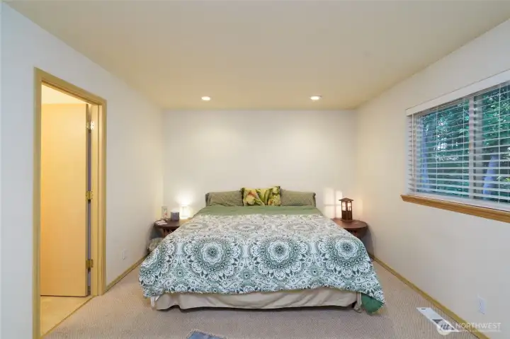 Primary bedroom with ensuite bathroom and a large walk-in closet.