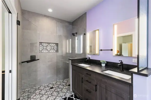 Primary ensuite with roll in shower, heated floors, custom vanity. A gorgeous upgrade!