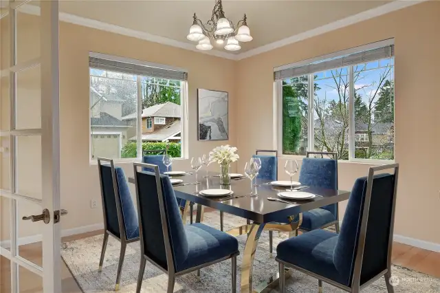 The dining room is adjacent to the living room and only steps from the kitchen, making this home ideal for entertaining.  A large window overlooks the front yard and a second large window overlooks the side yard.