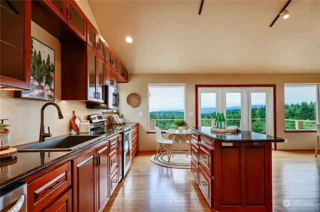 Spacious kitchen with granite countertops, and beautiful cabinetry