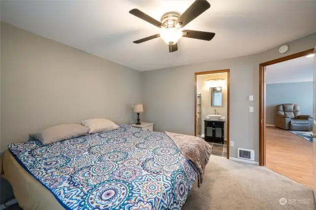 Pocket door entry to bathroom from primary bedroom.