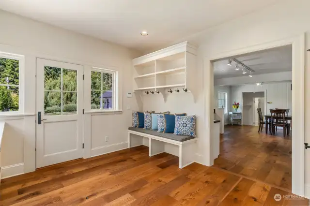 Main laundry room entrance from the front of the home.  All decked out with all the mud room amenities one would desire.