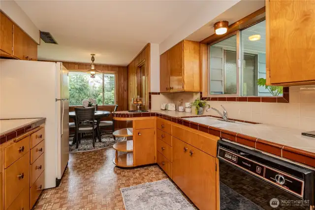 Love the retro feel of the Kitchen or bring fresh ideas to this space! Notice the Breakfast Nook beyond. The Laundry Room is to the right of the Nook and Family Room is to the left.