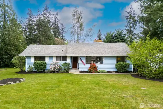 The home features 4 Bedrooms, 1.75 Bathrooms, sizable Living & Dining Rooms with cozy gas fireplace, Kitchen with Breakfast Nook and a Family Room featuring a wood burning insert and slider to serene backyard and deck. The forced air furnace and A/C keep you comfortable in every season.