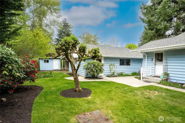 An 8.5' x 11.5' Garden Shed is conveniently located to the rear of the Garage/Shop.