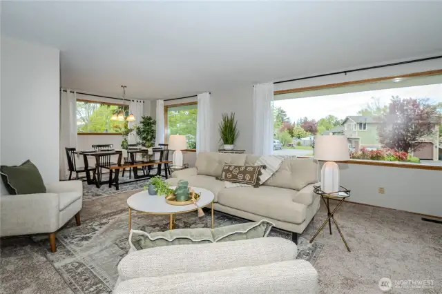 The Living & Dining Rooms feature expansive windows offering wonderful natural light and serene front yard views.