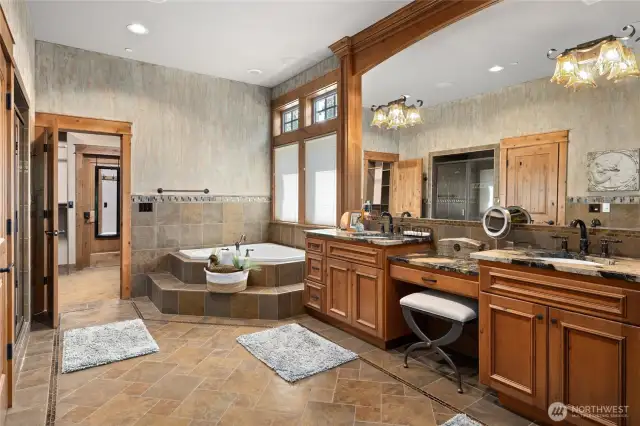 Stunning oversized master bath with double sinks, jacuzzi tub, large shower and private water closet.