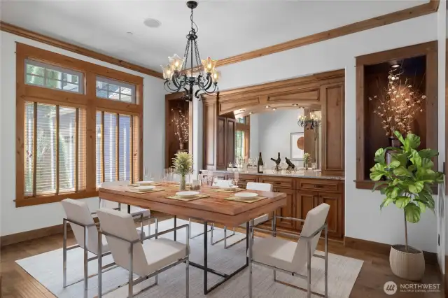 Light-filled dining area with beautifully maintained wood floors and functional built-in cabinetry.
