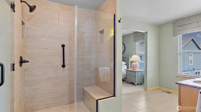 Primary Bathroom featuring tiled shower with Bench