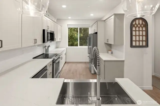 Open concept living/dining/kitchen- high ceilings, AC & tons of natural light