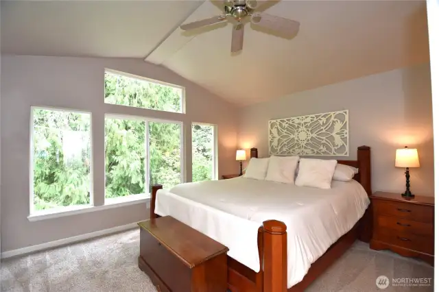 Primary bedroom with tons of natural lighting.