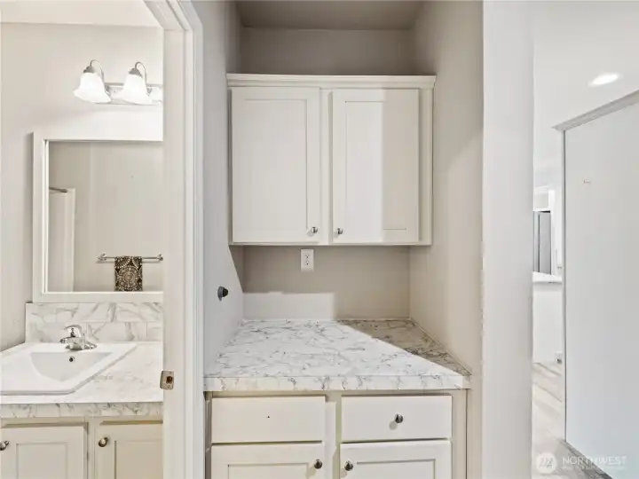 Guest bathroom with laundry nook
