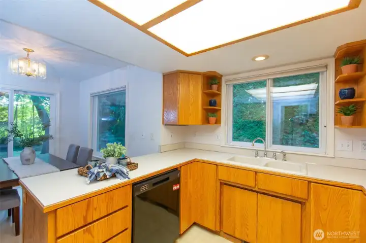 Such a nice open layout - chef can easily visit with guests in dining room and living room beyond.