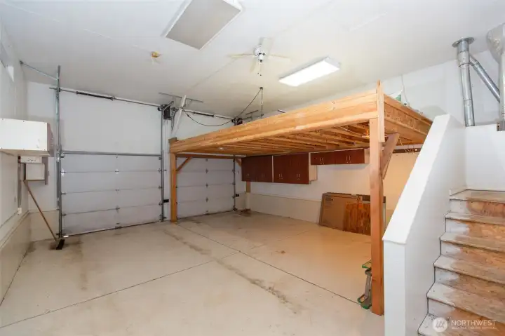 572 sf attached garage has extra-sturdy storage loft.