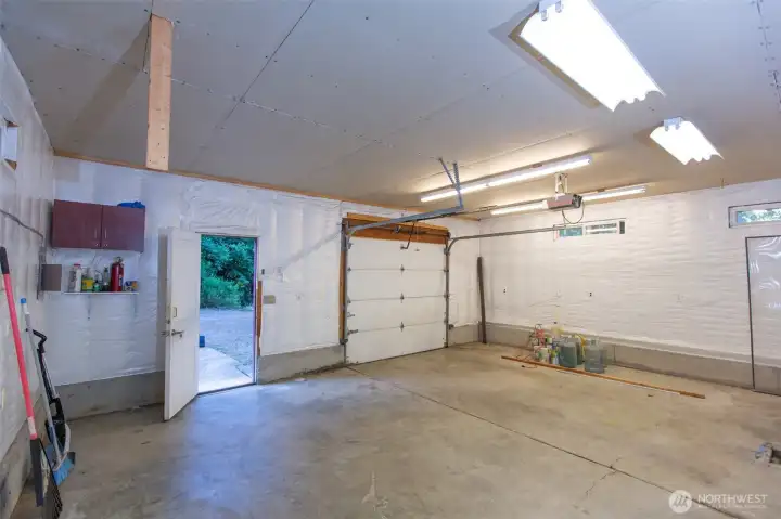 Shop also features three 220 outlets, each with its own circuit -walls are insulated and covered with tyvek wrap - ready for sheetrock if you choose.