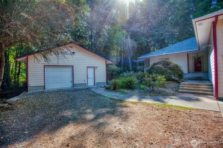 Pretty surroundings for rambler, shop, RV parking all on .38 acres.