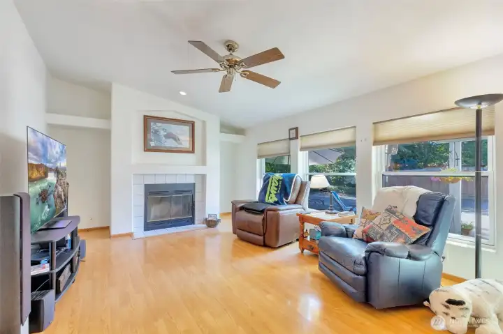 Family room with wood burning fireplace and new windows!
