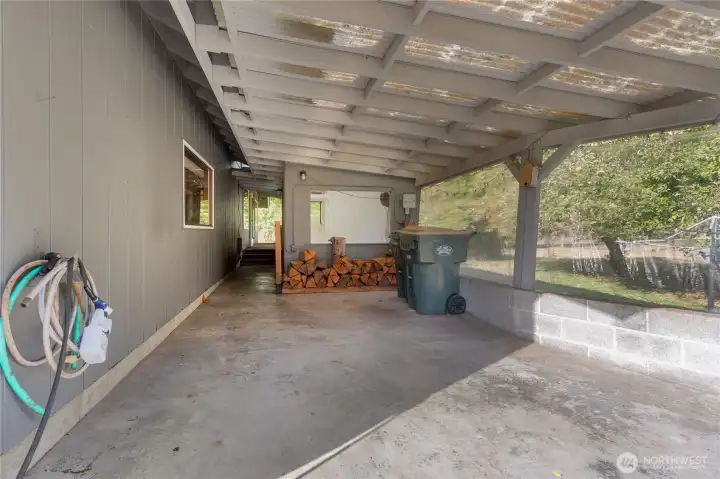 covered carport and wood storage