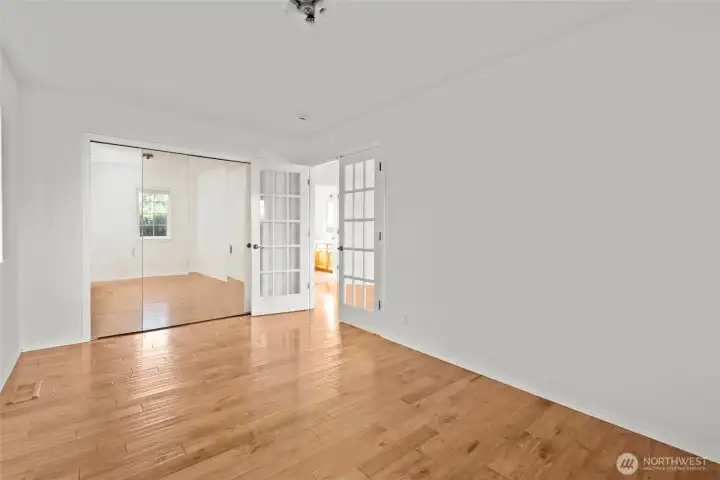 Bedroom 3 with closet organizer and mirrored bifold doors