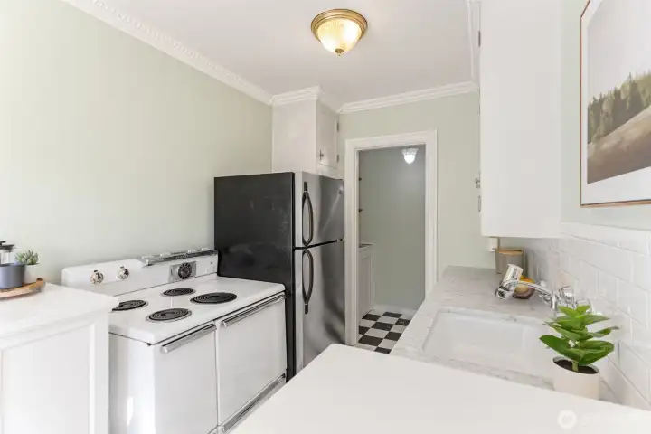 Charming features; marble counters, original hardwood floors, cool cabinetry.