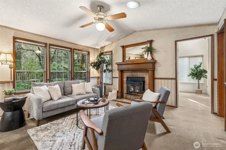 Family room w/ a wood burning fireplace