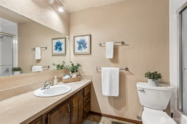 Full bathroom located down the hall