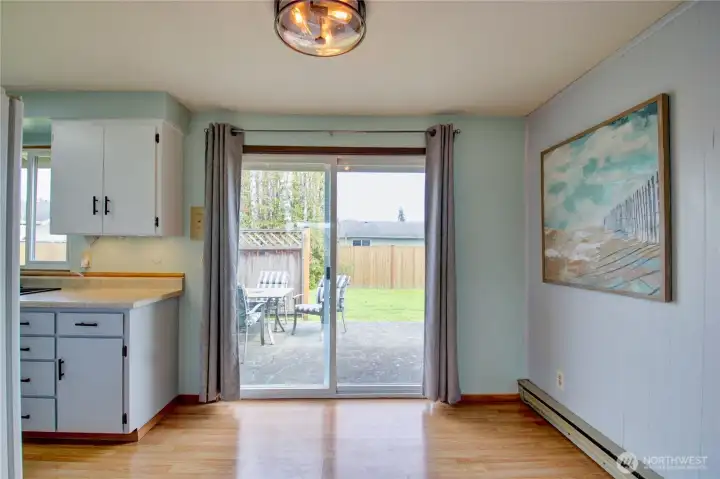 Dining area with access to back patio and yard.