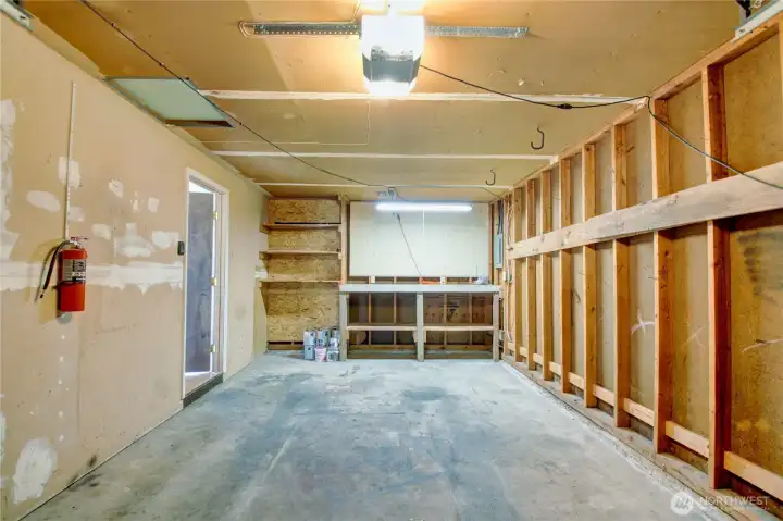 Single car garage with work bench.