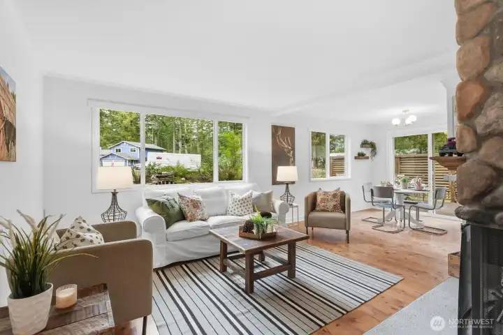 Sunlit living room with expansive windows that fill the space with natural light.