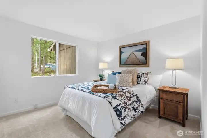 Generous main-level primary bedroom and bath with new carpet for added comfort.