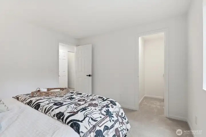 Primary bedroom features a walk-in closet and private ensuite bath.