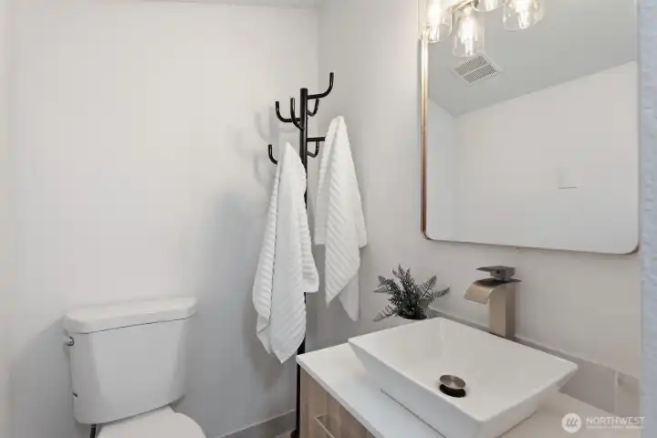 Upstairs bath is ideally located between two bedrooms at the top of the stairs for convenient access.