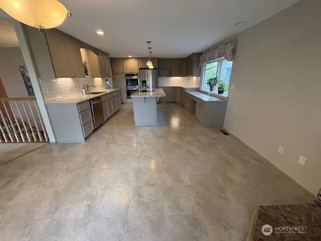 Eating space within kitchen - looks out at patio and mountain with River below