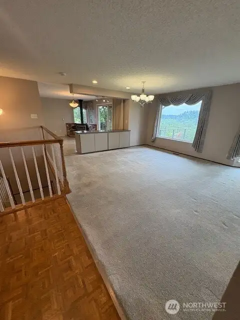 Looking toward kitchen w/eating space and dining room