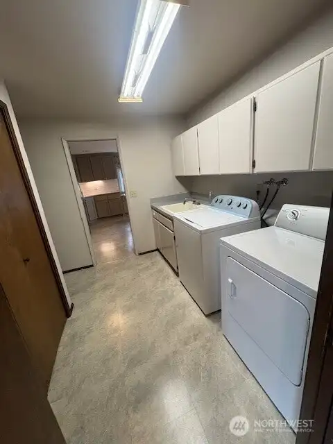 Utility on main level - washer and dry stay