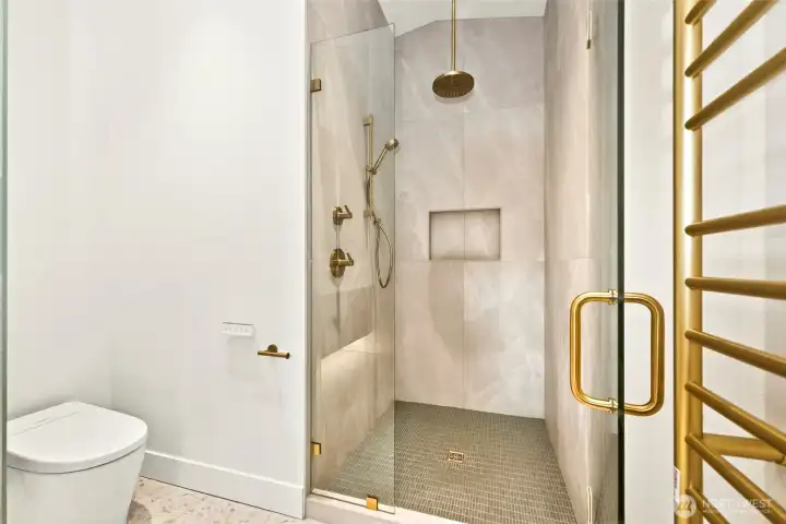 Walk in shower with dual fixtures, rain showerhead, custom niche, and imported tile. Large heated towel rack so you have all the spa conforts at home. Walk in shower with dual fixtures, rain showerhead, custom niche, and imported tile. Large heated towel rack so you have all the spa conforts at home.