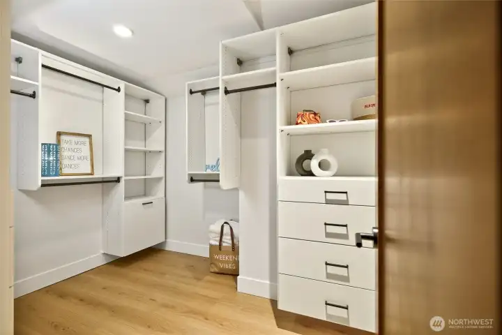 Large walk-in closet with custom closet package. Large walk-in closet with custom closet package.