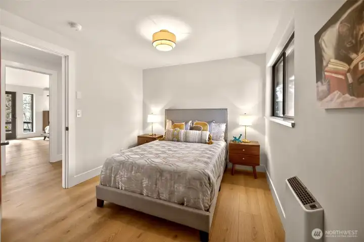 2nd Bedroom - Full/Queen-size bed space with great natural light and greenery views. 2nd Bedroom - Full/Queen-size bed space with great natural light and greenery views.