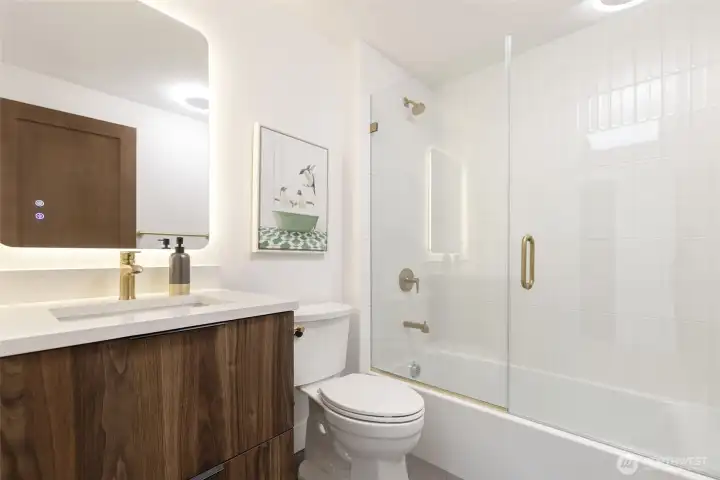 Large full bath with heated tile floor, custom tile shower, LED back-lit mirror, and bidet-ready toilet. Large full bath with heated tile floor, custom tile shower, LED back-lit mirror, and bidet-ready toilet.