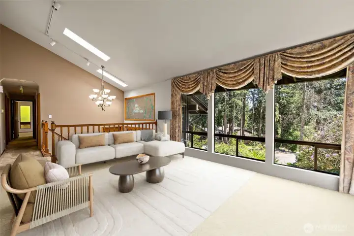 Digitally staged - Living room with big windows, vaulted ceilings and skylights for lots of natural light