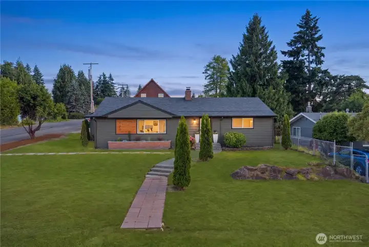 Situated on a large corner lot with excellent yard space, and flexible outdoor use